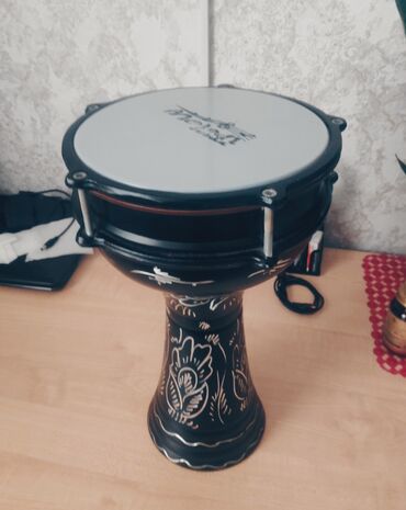 darbuka: Alinandan istifade olunmayib teze kimi qalib. Metal yungul korpus