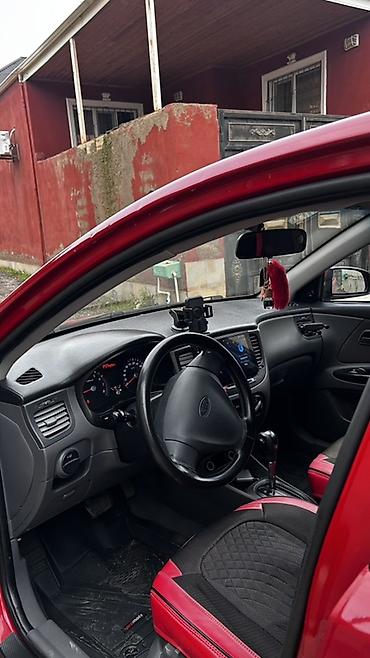 90 fa 373: Kia Rio: 1.4 l | 2010 il Sedan — 4