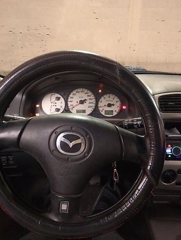 х5 м: Mazda Familia: 2001 г., Бензин, Универсал — 9