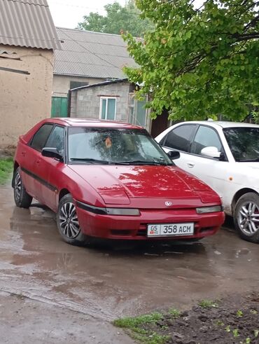 мазда 627: Mazda 323: 1993 г., 1.6 л, Механика, Бензин, Седан