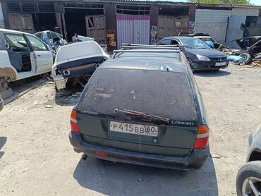 Другие детали кузова: Универсал Mitsubishi Lancer, модель пятого поколения, в темно-зеленом — 3