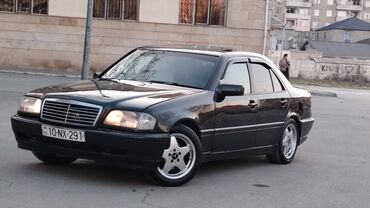 nolyeddi maşını: Mercedes-Benz 200: 2 l | 1995 il Sedan