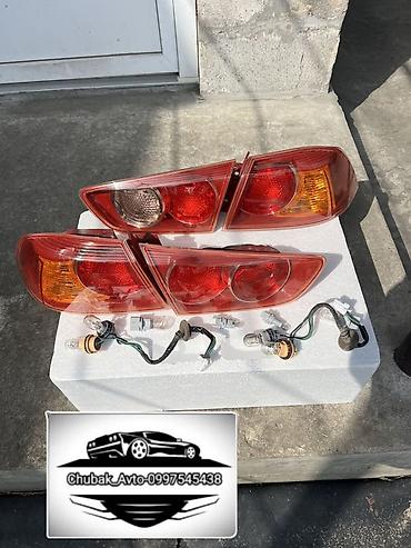 Стоп-сигналы: Комплект стоп-сигналов Mitsubishi 2007 г., Новый, Аналог — 2