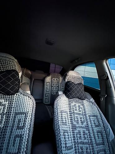 385 55: Продаётся седан Kia Cerato серебристого цвета. Автомобиль 4-дверный — 7
