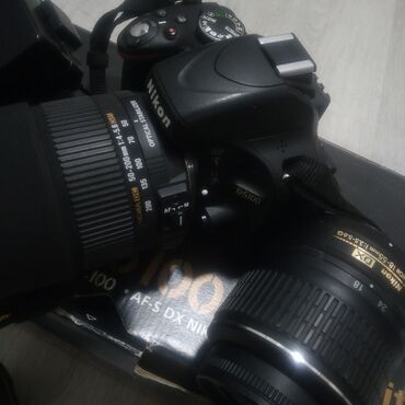 апарат макарон: Зеркальная камера Nikon D5100 (DX) с комплектом аксессуаров. Состав