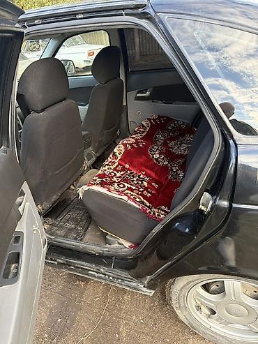 опель зафира а: Lada Priora sedan – qara rəng Texniki xüsusiyyətlər: - Kuzov: 4 — 5