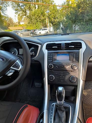 ford: Ford Fusion sedan satılır. Avtomobil gümüşü rəngdədir və zərif — 2