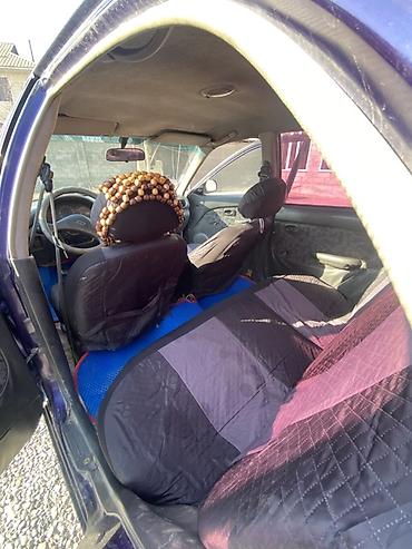 Другие автомобили: Седан компакт-класса, 4 двери, темно-фиолетовый цвет. Кузов с — 3