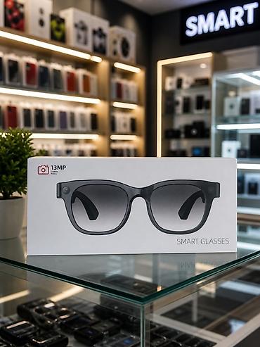 smart glasses: Smart Eynək – 13 MP kamera ilə Xüsusiyyətlər: - Gözlük çərçivəsinə — 2