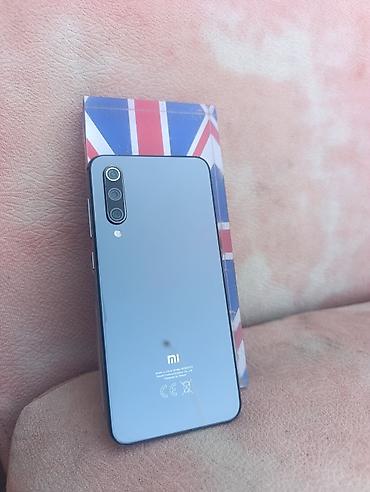 honor p 50: Xiaomi Mi 9 SE, rəng - Boz, 
 Barmaq izi — 1