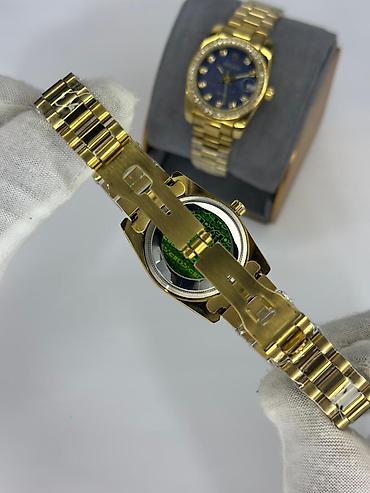 das sekilleri: Rolex Datejust stilində qızılı qol saatı - Korpus və qolbaq: qızılı — 10