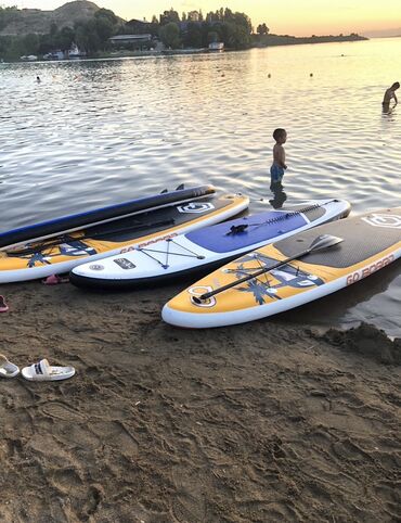 купить пластиковую лодку бу: Надувная доска для сапсерфинга Go Board, представленная в ярком желтом