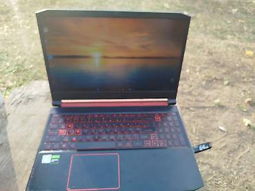 lenovo log: Игровой ноутбук Acer Nitro 5 (серия AN5xx) в черно-красном дизайне — 1