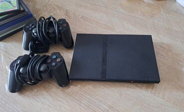 ps2 ikinci el: Playstation 2 + 2 orginal pult + yaddaş kartı + 7 oyun (gta, pes ve