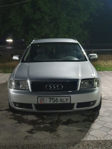 audi a1: Универсал Audi A6 серебристого цвета. Автомобиль оснащен рейлингами на