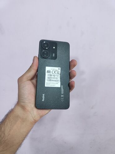 telefon flai 440: Xiaomi Redmi 13C, 256 ГБ, цвет - Черный, 
 Кнопочный, Отпечаток пальца, Face ID