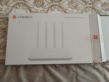 mi printer: Məhsul: Xiaomi Mi Router 4C (R4CM) Xüsusiyyətlər: - 2.4 GHz Wi‑Fi — 1