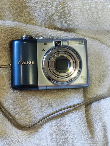 компактные фотоаппараты: ПРОДАЮ компактный фотоаппарат Canon A1000 IS, работает отлично