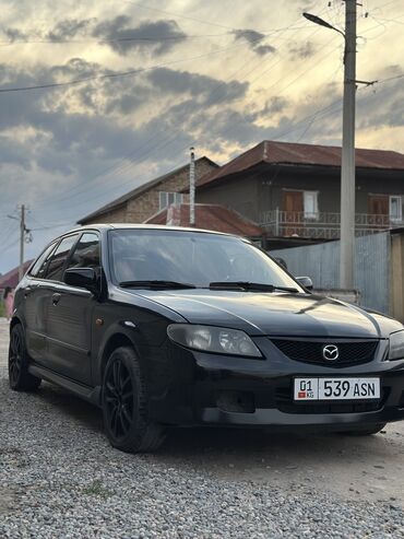 эшка 302 303: Mazda 323: 2003 г., 2 л, Механика, Бензин, Хетчбек