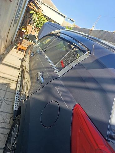 kia cerato manitoru: Kia Sportage (III nəsil) krossover - Kuzov: tünd-boz rəng, 5 qapı - — 7
