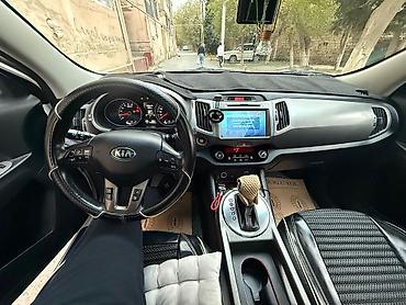 su radiatoru: Kia Sportage, ağ rəng, kompakt krossover. Güclü və qənaətcil — 7