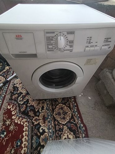 set podloga protiv buke i klizanja za veš mašinu: Bela veš mašina marke AEG Lavanat, model L54630, sa bubnjem od