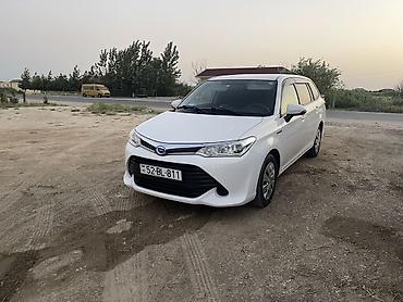 üstü açıq maşın: (Toyota) Corolla Fielder Hybrid – ağ rəngli universal kuzov — 1