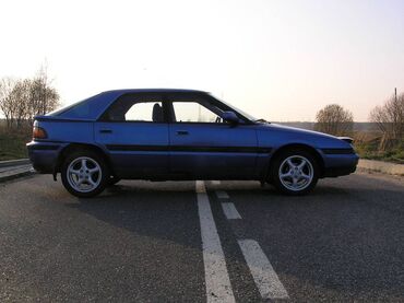 мазда слепая: Задний Mazda 1992 г., Б/у, цвет - Голубой