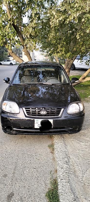 pər: Hyundai Accent: 1.5 l | 2005 il Sedan — 1