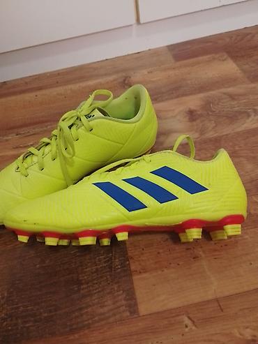 Kopačke: Fudbalske kopačke Adidas (model linije Nemeziz) za prirodnu travu - — 1