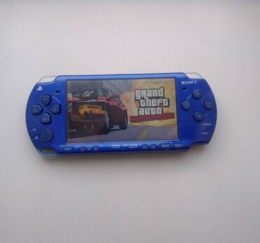 PSP (Sony PlayStation Portable): PSP e2000 слимка. Работает хорошо. Прошитая. В комплекте флешка на 4