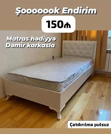 Çarpayılar: Ağ rəngli tək nəfərlik çarpayı – klassik dizayn, yumşaq başlıqla. - — 1