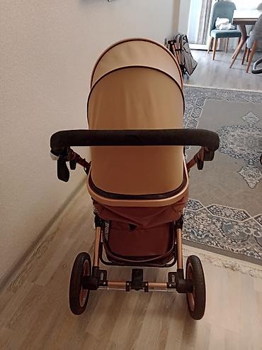 Araba-beşiklər: Uşaq arabası – Swisssonic marka, qəhvəyi/qızılı rəng palitrası ilə — 1
