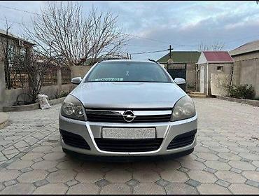 opel təkərləri: Opel Astra Caravan (universál kuzov), gümüşü rəng. Əsas məlumat: - — 1