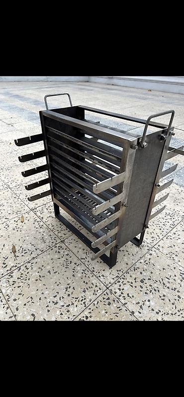 Manqallar, qrillər, barbekyu: İkitərəfli eko manqal. Manqala orta boşluq hissədən kömür tökülür və — 2
