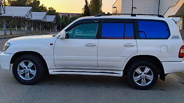 1998 ford transit: Toyota Land Cruiser 100 (J100) – ağ rəng, 5 qapı, tam ölçülü off-road — 4