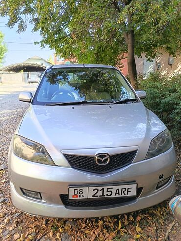 экономичные машины: Mazda Demio: 2002 г., 1.3 л, Автомат, Бензин, Хетчбек