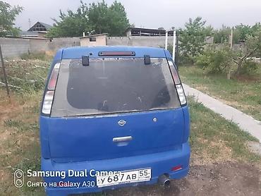араб 2 бака: Nissan Cube (кузов Z10), правый руль, хэтчбек 5‑дверный. Цвет синий — 8