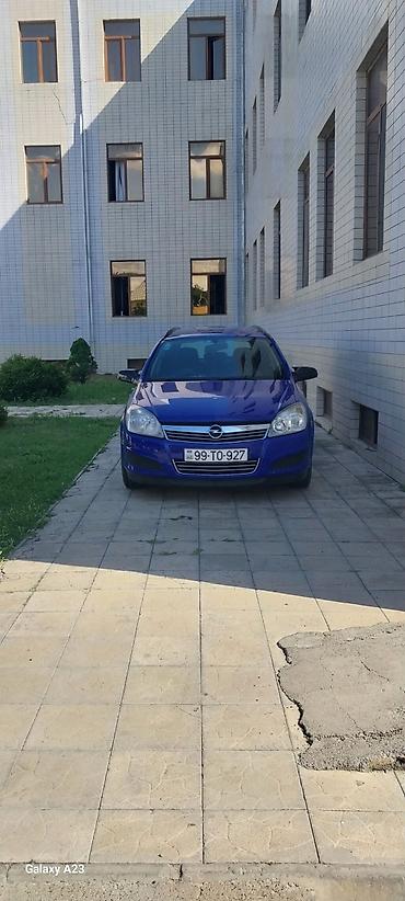 opel astra k: Opel Astra Caravan (universal), mavi rəng. Kuzov: 5 qapılı, geniş — 2