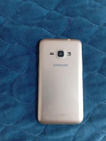 Samsung Galaxy J1, 4 GB, rəng - Qızılı, Düyməli, Sensor, İki sim kartlı