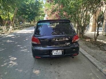 Mitsubishi: Mitsubishi Airtrek, qara rəng, universal kuzov. Xüsusiyyətlər: - — 1