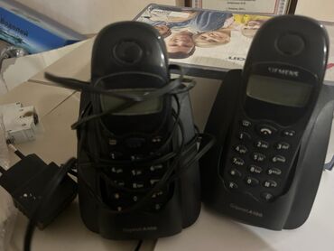 телефонные аппараты с беспроводной трубкой германия цветные: Стационарный телефон Беспроводной