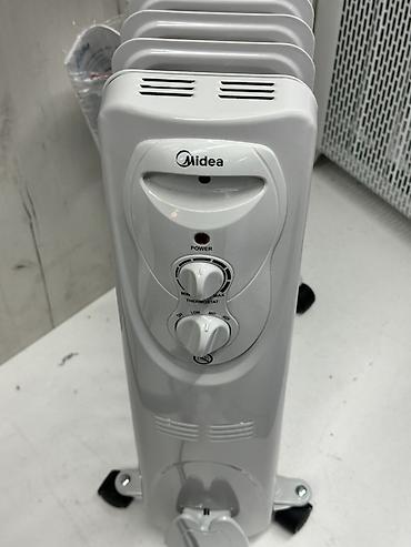 midea: Масляный обогреватель Кол-во секций: 9, Несколько режимов мощности — 2