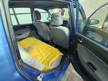 авто бак: Daihatsu Cuore: 2003 г., Механика, Бензин, Хэтчбэк — 7