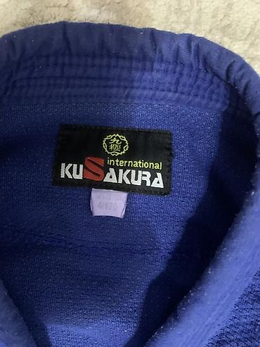 нашивка: Куртка кимоно для дзюдо KUSAKURA International, синяя. - Официальный — 2
