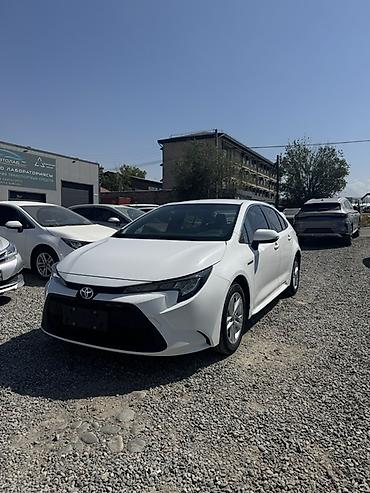 byd e1: Toyota Corolla: 2023 г., 1.8 л, Вариатор, Гибрид, Седан — 1