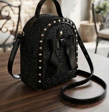 Elegantna mini torba sa šljokicama i mašnom - Model: kompaktna