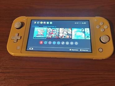switch 2: Nintendo Switch Lite Konsol mukemmel veziyyetdedir Seliqeli istifade — 1