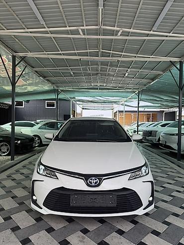 lada 9: Toyota Corolla: 2022 г., 1.8 л, Гибрид, Седан — 2