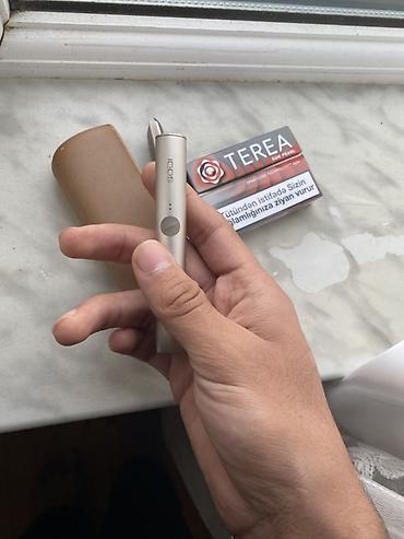 qizilar: IQOS Terea uyğun tütün qızdırma qurğusu Məhsulun tərkibi: - IQOS — 1